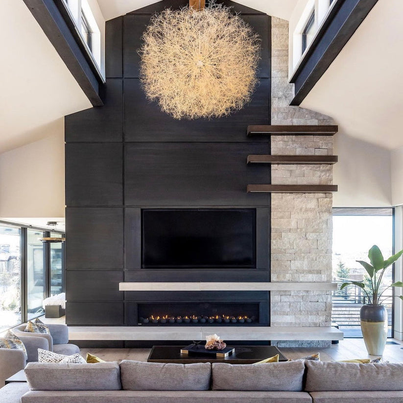 Tumbleweed pendant in lifestyle shot featuring fireplace in living room space. Pendant made by Owen Mortensen.